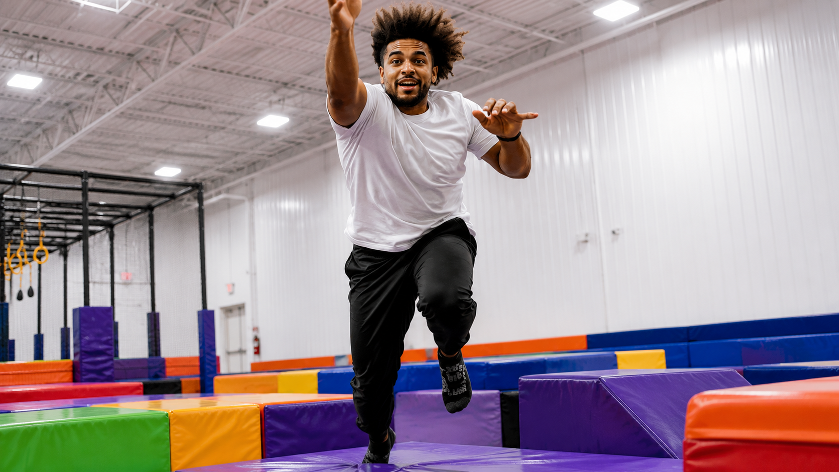 Team member jumping mid-air at Bump City