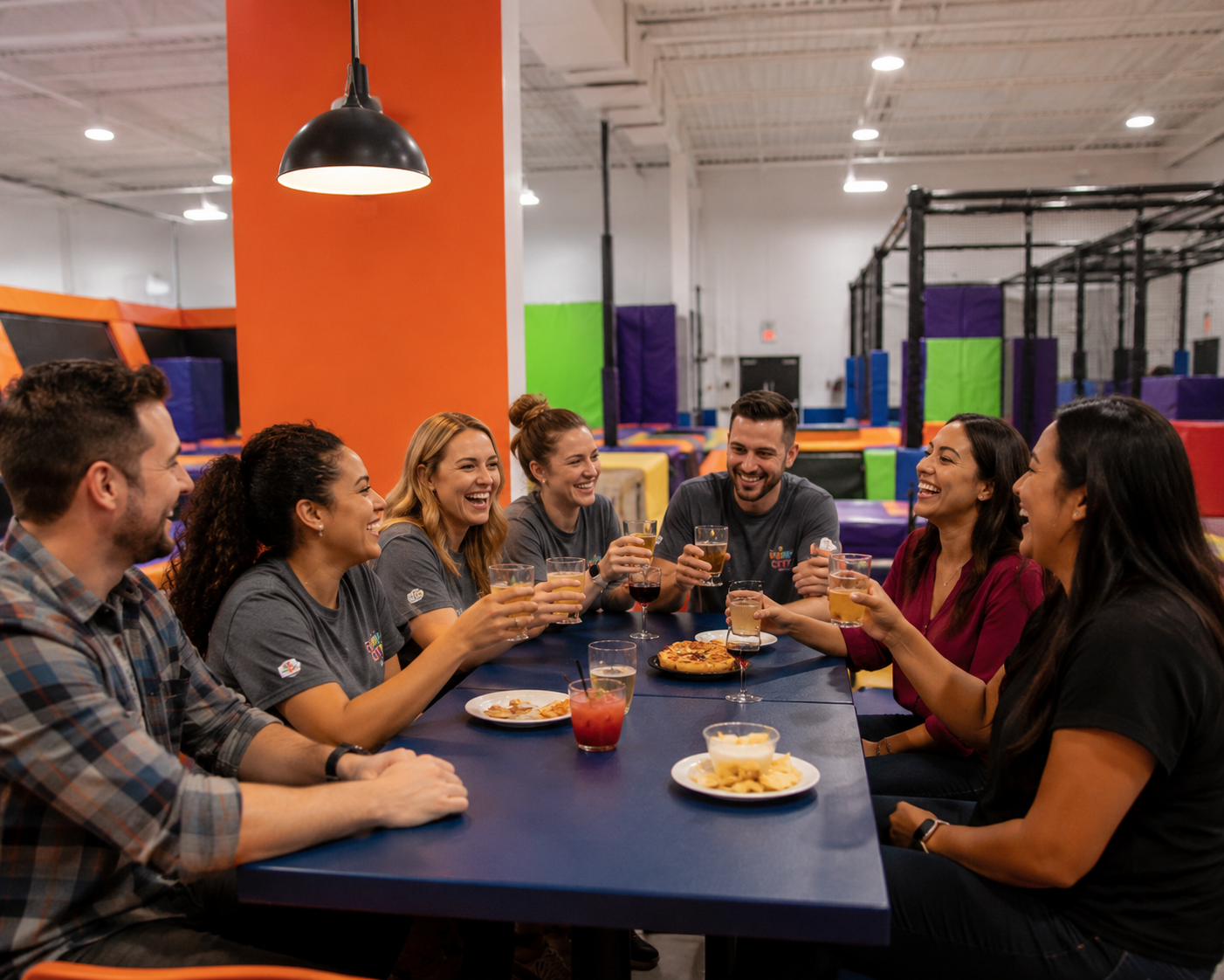 Team cheersing drinks together at Bump City