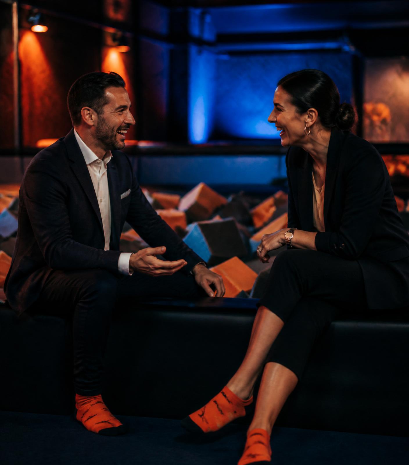 Two professionals in conversation at Bump City